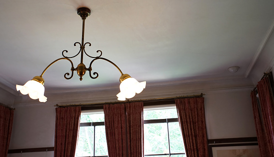 luxurious black metal chandelier hanging on the ceiling