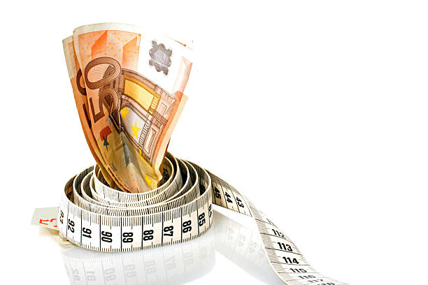 istock Money with a tape measure wrapped around it 178521907