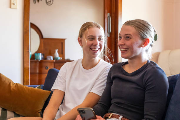 istock Happy young women using phone at home 1785219325