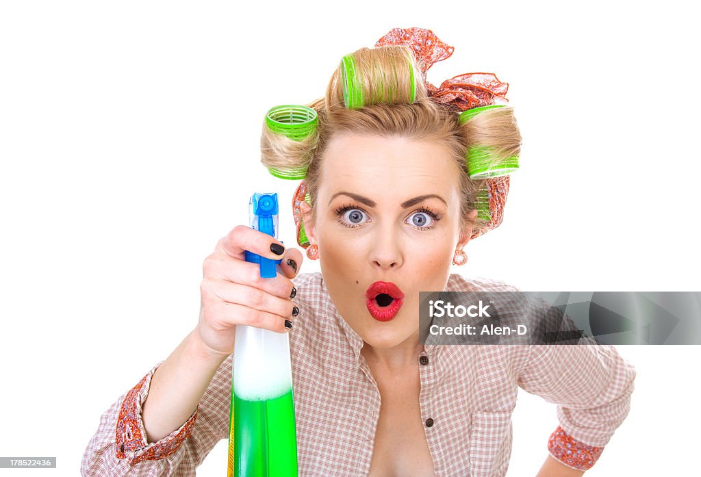 Funny housewife / woman spraying the cleaner on you "Funny housewife / woman spraying the cleaner on you, isolated on white. Glass or window cleaner" Cleaning Stock Photo