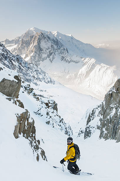 Skier in couloir with Mont Blanc as background stock photo