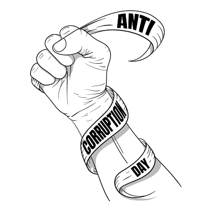 Hand holding a ribbon that says anti-corruption day for anti-corruption day