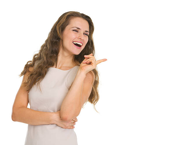 istock Smiling young woman pointing on copy space 178523826
