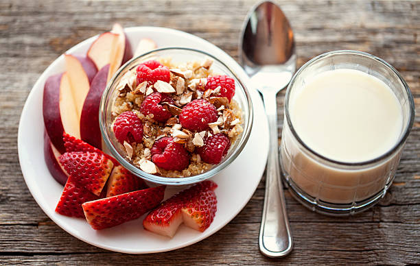hot Healthy breakfast of Quinoa with chopped nuts fresh fruit