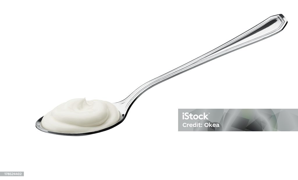 yogurt on spoon teaspoon of yogurt isolated on white background Yogurt Stock Photo