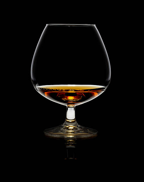 istock Glass of whiskey over black background 178524429
