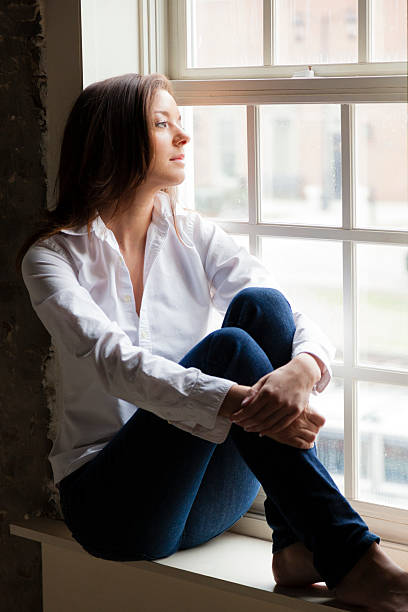 istock Woman by the window 178524793
