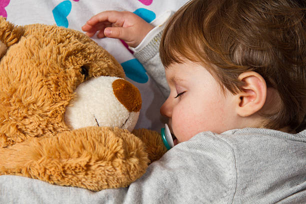 istock Sweet child sleeping with teddy bear 178524892
