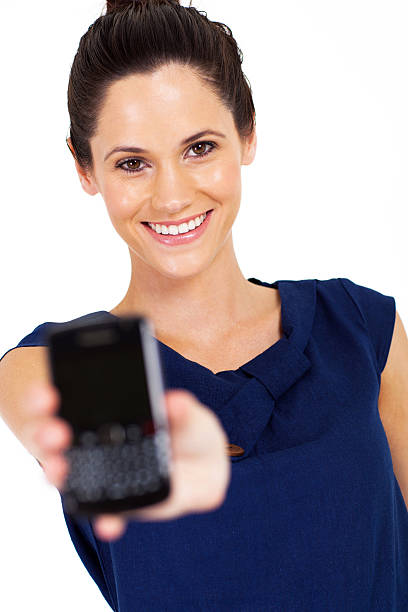 istock gorgeous young woman holding smart phone 178525283