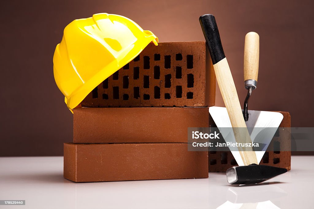 Construção de plano de fundo, Colher de Pedreiro e tijolos - Foto de stock de Armação de Construção royalty-free