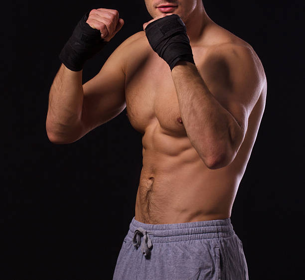 istock Handsome unrecognizable shirtless male boxer, ready to fight 178525443