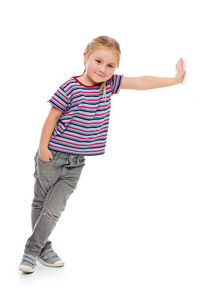 istock Little girl leaning against a white wall. 178525627