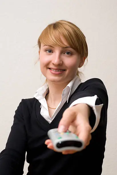 young woman with remote control