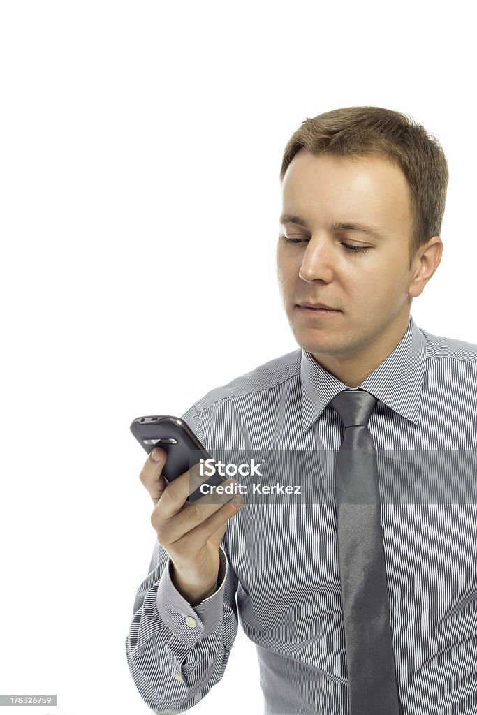 Man looking at cell phone. Man typing text message on mobile phone. Adult Stock Photo