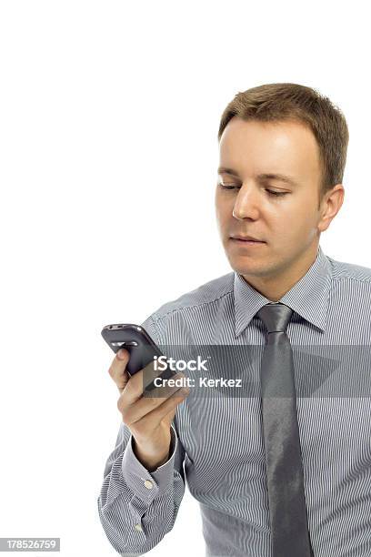 Man Looking At Cell Phone Stock Photo - Download Image Now - Adult, Adults Only, Beautiful People
