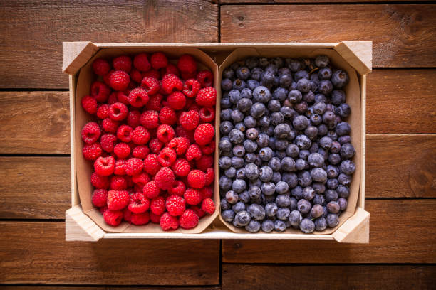 istock Wooden crate filled with blueberries and raspberries 1785271412