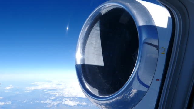 Rear Mounted Turbofan Jet engine View from Airplane Passenger Window