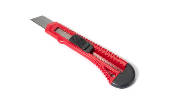 istock Red stationery knife with a blade isolated on a white background 1785272370