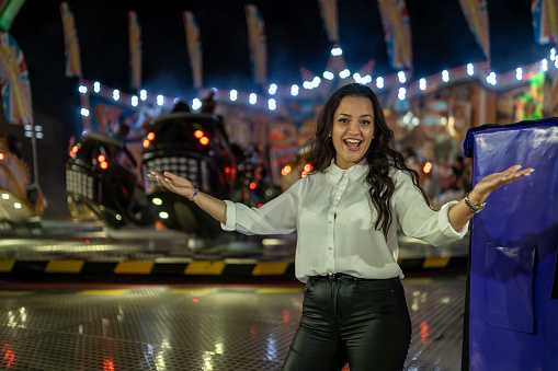 Luna park, night life and beautiful young lady.