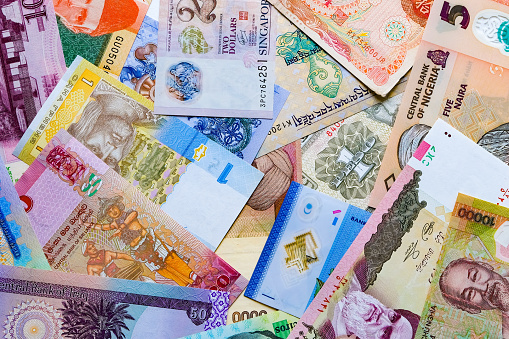 Country multi-currency banknotes and currency exchange concept stock