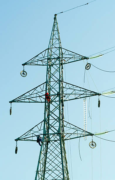 Workers on Electrical Pylone stock photo