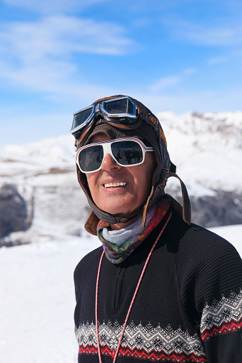 Active lifestyle, Portrait Vital happy senior  men snow skier, enjoying on sunny ski resorts.  Snowcapped mountain  Alps  ski area. Ski resort Livigno. italy, Europe. Ski opening.
