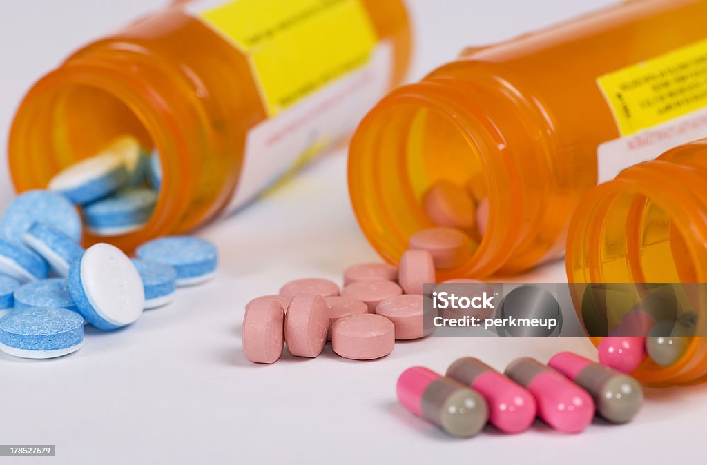 Daily Dose 2 The daily dose of medicine on a table....good or bad Generic Drug Stock Photo