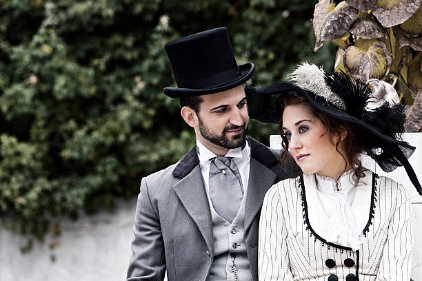 istock Old-fashioned dressed couple in the park 178528188