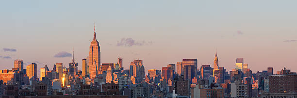 Manhattan skyline with midtown skyscrapers at sunset stock photo