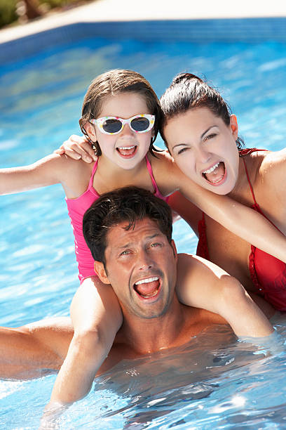 istock Family Having Fun In Swimming Pool 178528733