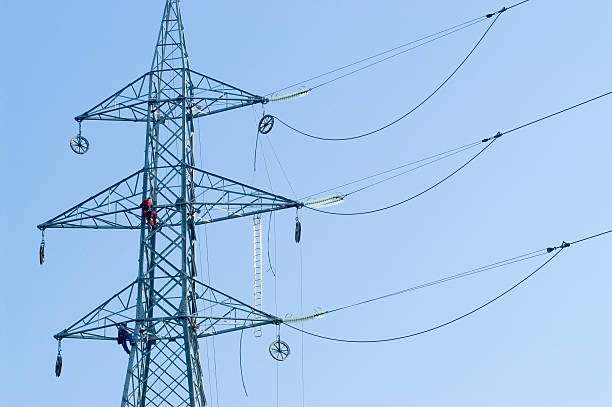 Workers on Electrical Pylone stock photo