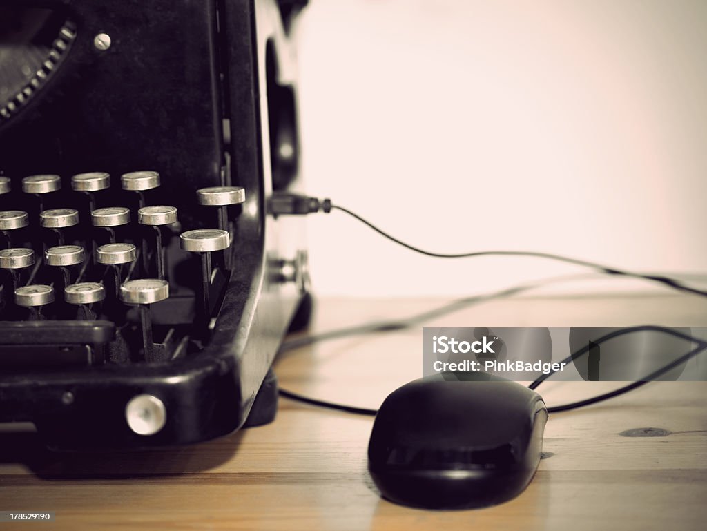 Vintage personal computer Compoter mouse connected to vintage typewriter Black Color Stock Photo