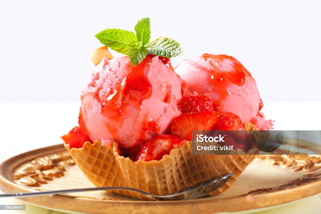 Ice cream with strawberries in wafer bowl Ice cream with fresh strawberries in wafer bowl Strawberry Ice Cream Stock Photo