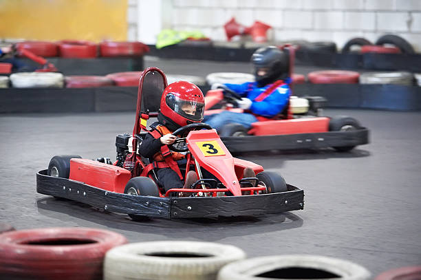 Competition for children karting Competition for children karting indoors crash helmet photos stock pictures, royalty-free photos & images