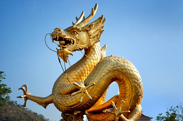 istock Golden dragon over blue sky 178529775