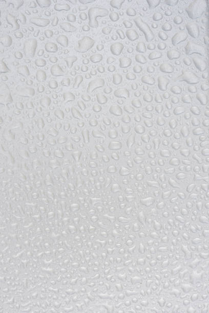 istock Silver liquid drops, many drops of abstract shapes on a silver b 1785299620