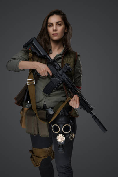 istock Middle Eastern Survivalist Woman with Rifle 1785300826