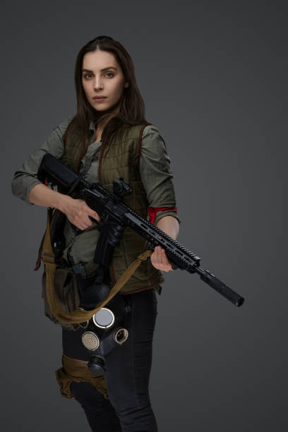 istock Middle Eastern Survivalist Woman with Rifle 1785301902