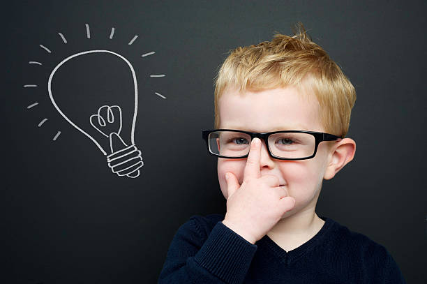 istock Smart young boy stood infront of a blackboard 178530679