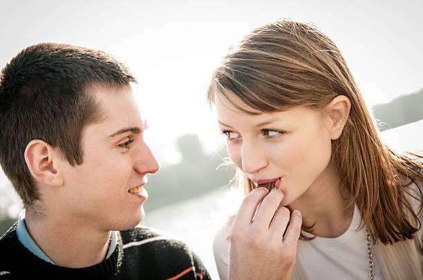 istock Young couple in locve eating chocolate 178530829