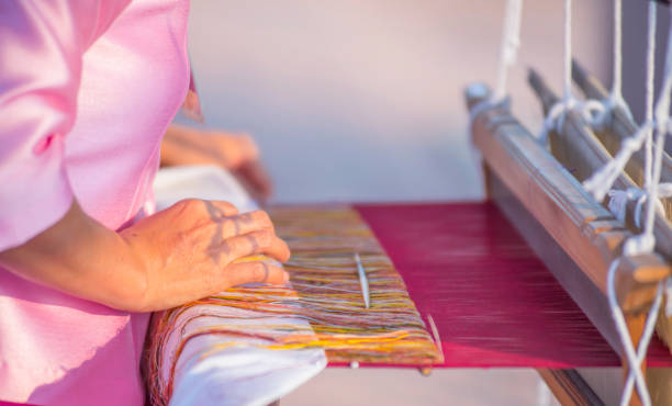 istock Photos of people working in weaving with traditional methods. 1785311936