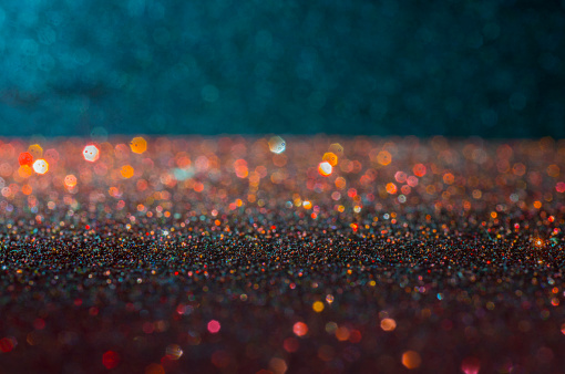 The scene of the sparkling light, the circle of red-orange tones blurred with black background
