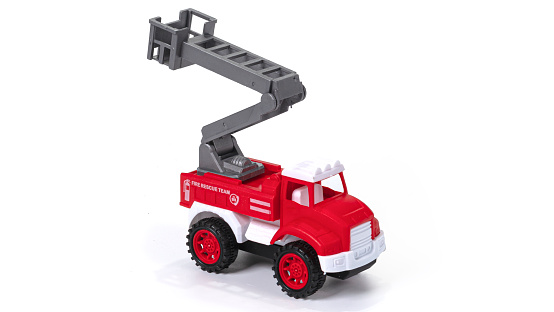 High quality photo. Plastic toy fire brigade telescopic lift isolated on white background.