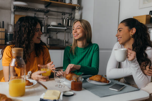 istock female friends at home 1785322322