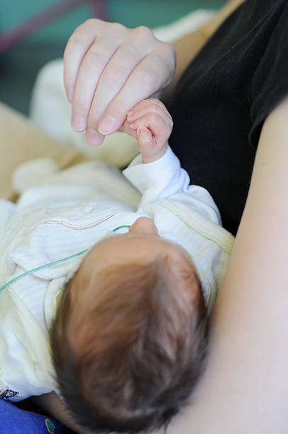 istock Mother holding newborn baby`s head 178532426