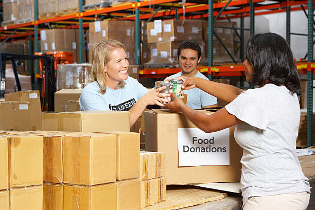 istock Volunteers Collecting Food Donations In Warehouse 178533027