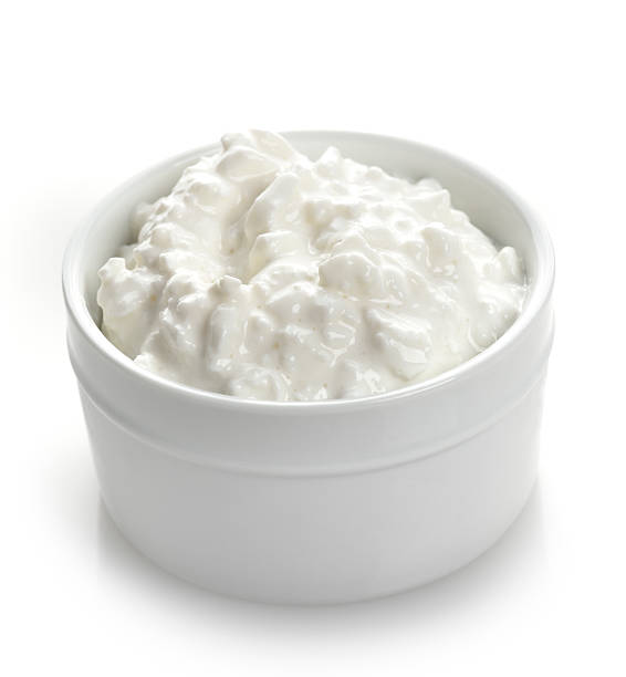 Cottage Cheese Cottage Cheese In A White Bowl cottage cheese photos stock pictures, royalty-free photos & images