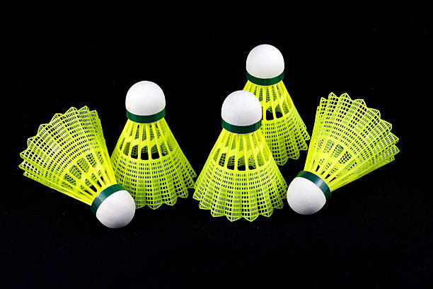 istock Yellow badminton shuttlecocks isolated on black 178534489