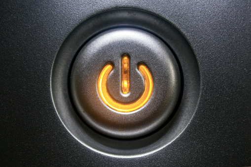 Standby button with orange light.