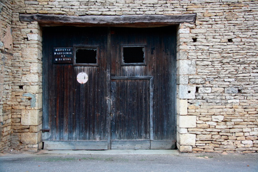 I took that photo in Scey Sur Saone.The door was old like that house